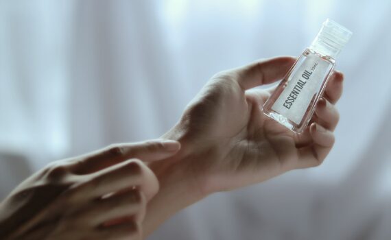 hand-holding-essential-oil-bottle